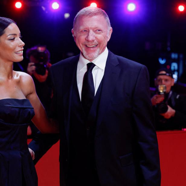 Boris Becker mit einer Frau auf dem roten Teppich.