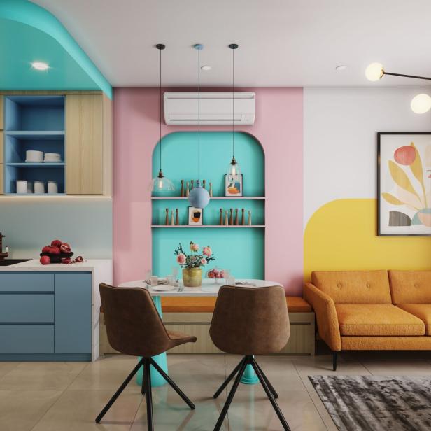 Ein farbenfrohes Wohnzimmer mit Küche, Essbereich und Sofa.