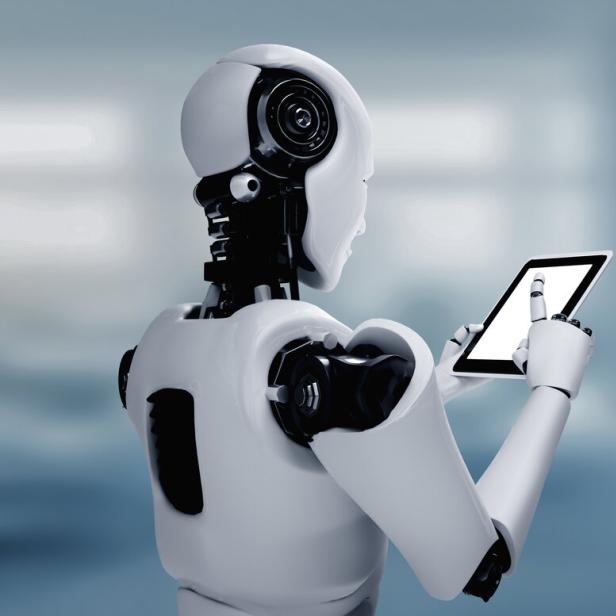 Ein humanoider Roboter bedient ein Tablet.