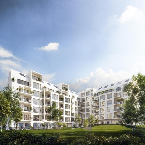 Ein Neubau mit einem begrünten Innenhof; und einem blauen Himmel