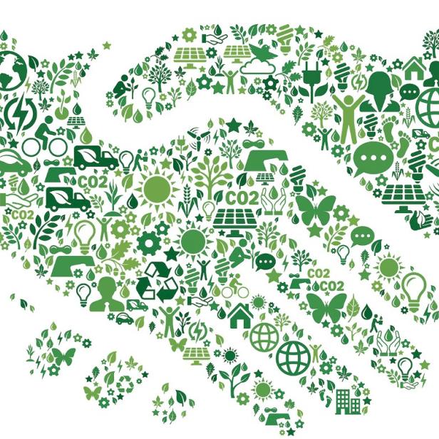 Zwei grüne Hände schütteln einander.