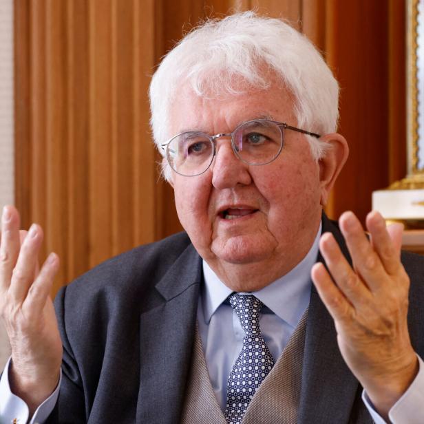 European Central Bank policymaker Robert Holzmann gestures in Vienna