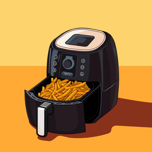 Eine Heißluftfritteuse mit einer Portion Pommes Frites.