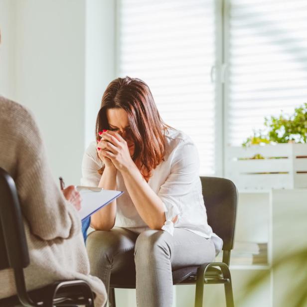 Depressed female with psychotherapist