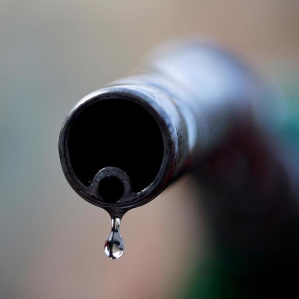 FILE PHOTO: A drop of diesel is seen at the tip of a nozzle in a petrol station in Nice