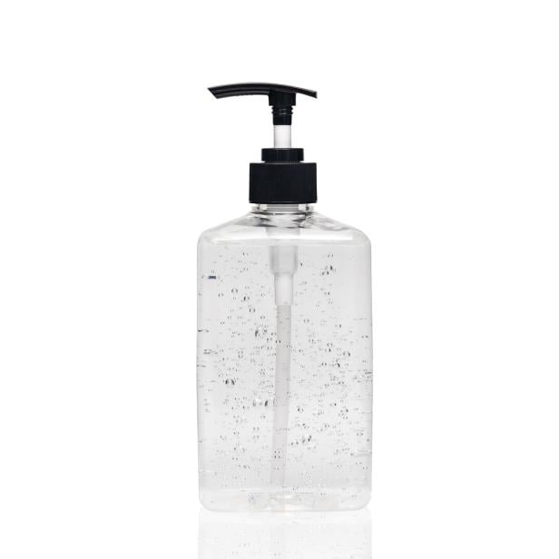 hand sanitizer alcohol gel in transparent plastic bottle pump isolated on white background for disinfection, prevent spreading of germs during infections of COVID-19 Coronavirus outbreak situation