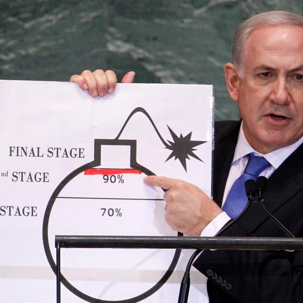 FILE PHOTO: Israel's Prime Minister Netanyahu points to red line he drew on graphic of bomb used to represent Iran's nuclear program, in New York