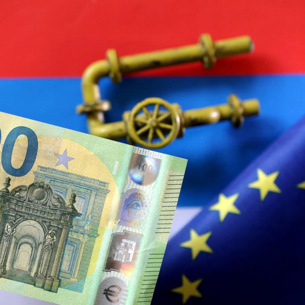 FILE PHOTO: Illustration shows model of natural gas pipeline, Rouble banknote, Russian flag and torn EU flag