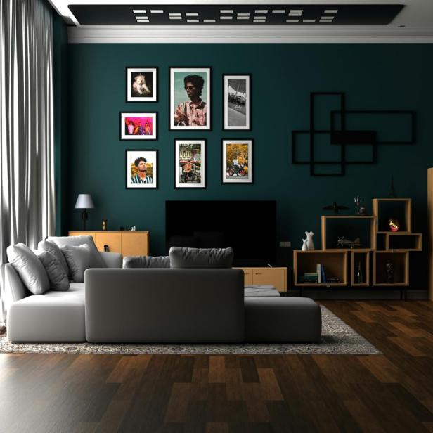Wohnzimmer mit dunklen grünen Wänden und Holzböden, gemütlich und einladend gestaltet.