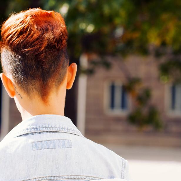 Rear view of a redhead woman