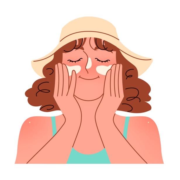 Eine Frau trägt Sonnenschutzmittel auf ihr Gesicht auf, um sich vor der Sonne zu schützen.