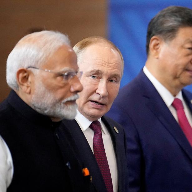 Narendra Modi, Wladimir Putin und Xi Jinping bei einem Treffen.
