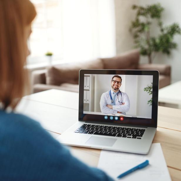 Woman making video call to doctor