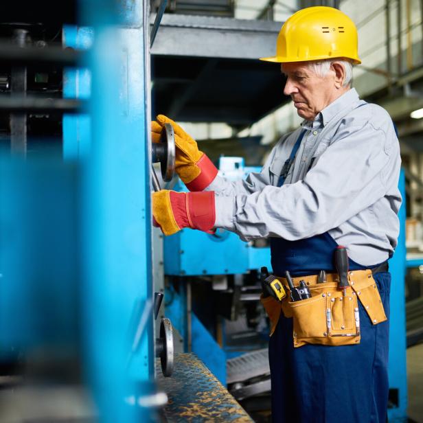 Senior Mechanic Repairing Machine Units at Factory