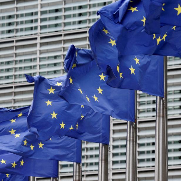 FILE PHOTO: European Union flags flutter outside the EU Commission headquarters in Brussels