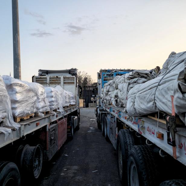 Trucks carrying humanitarian aid and fuel at the Rafah border on the Egypt side