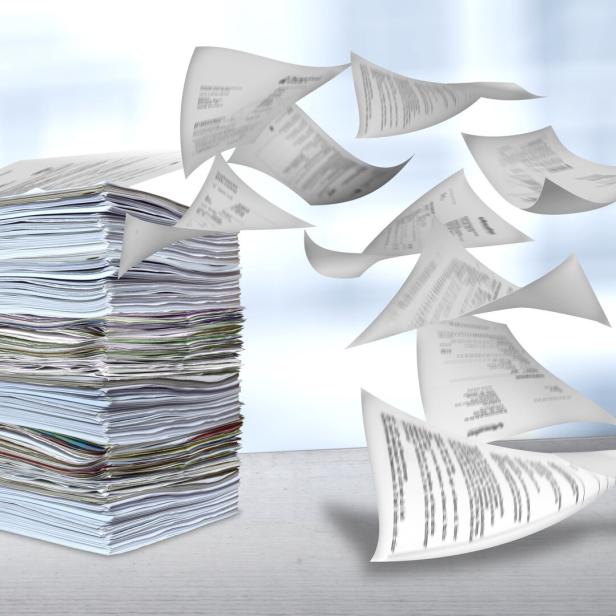 big pile of paper being blown away