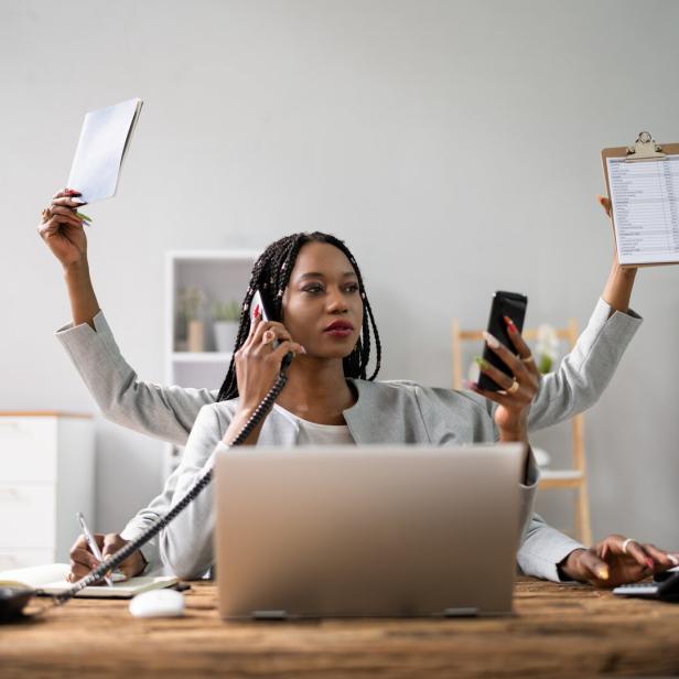 Multitasking Businesswoman In Office