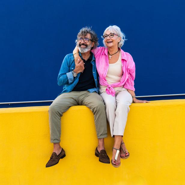 Beautiful happy senior couple bonding outdoors