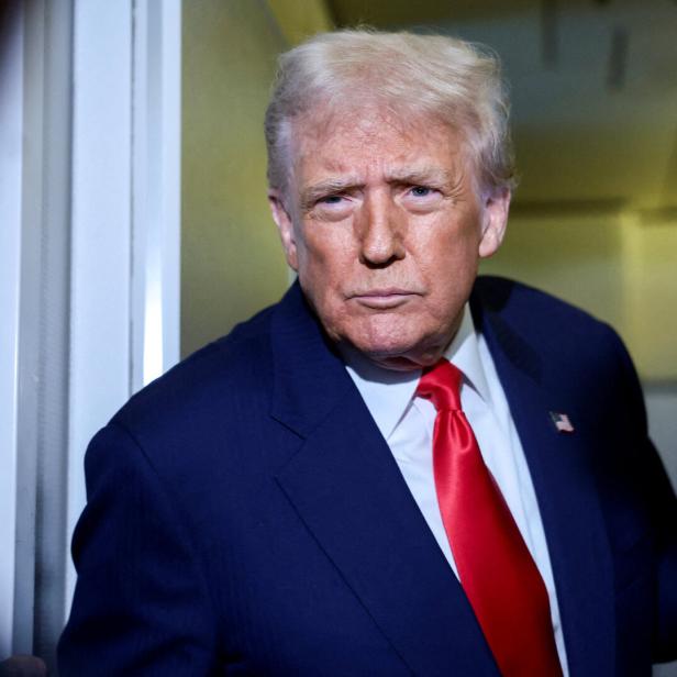 FILE PHOTO: U.S. President Donald Trump speaks to members of the media on board Air Force One en route to the U.S