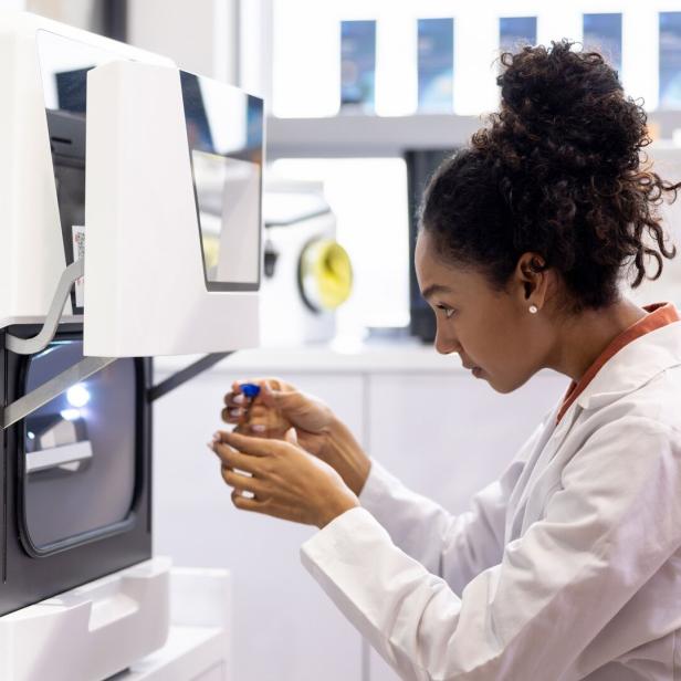Health engineer bioprinting models at a 3D laboratory