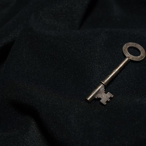 Vintage key on black background