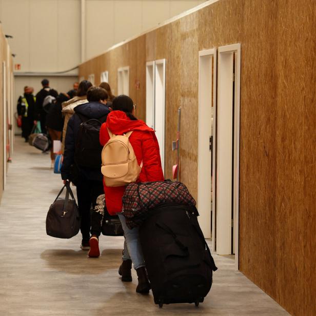 Ukrainian refugees arrive at a temporary shelter in Hanau