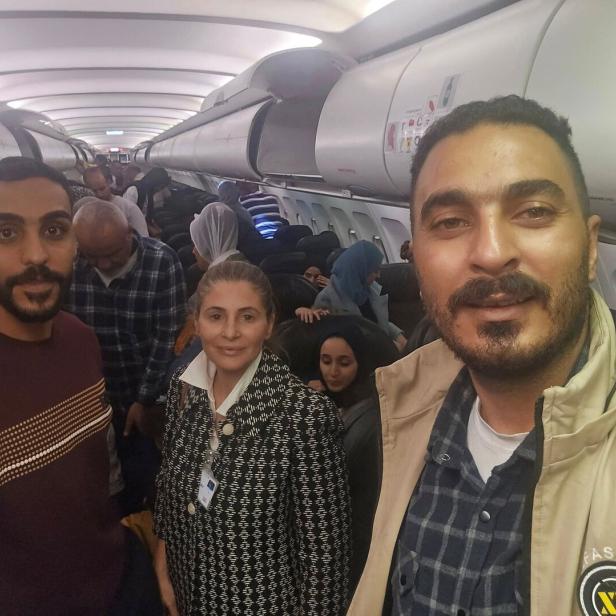 Hanan Jarrar, Palestinian ambassador to South Africa, smiles for a picture on a plane in a location given as given as Johannesburg