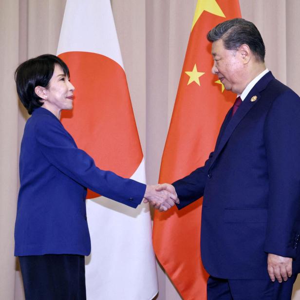Japanese Prime Minister Sanae Takaichi shakes hands with Chinese President Xi Jinping ahead of their talks in Gyeongju, South Korea
