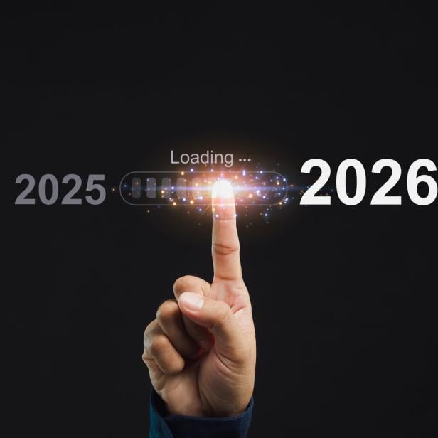 Hand pointing at progress bar loading 2026. Concept of future and technology.