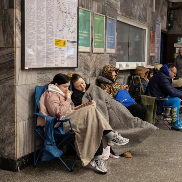 People shelter at the metro station during a Russian drone and missile attack in Kyiv