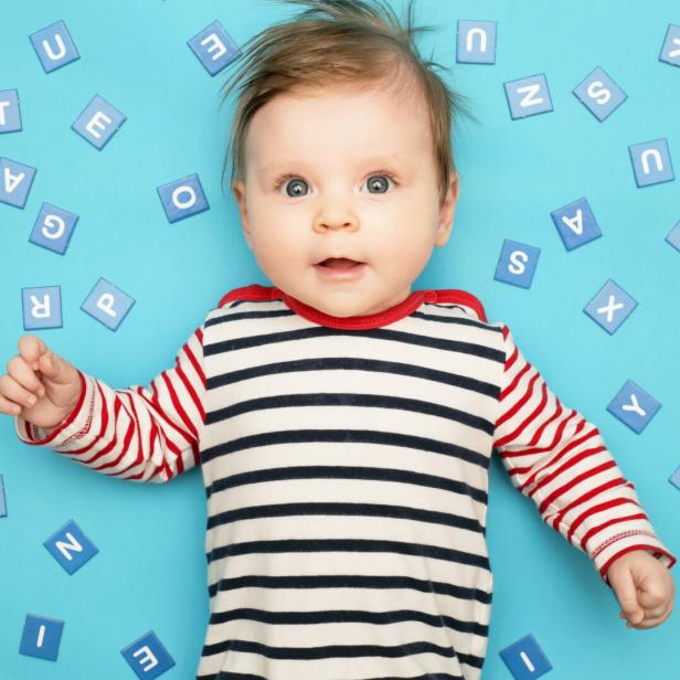 Portrait of adorable 3 months old baby on the blue background, studio shot