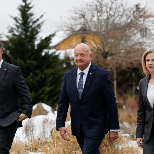 Austrian ruling coalition's leaders speak to reporters before meeting