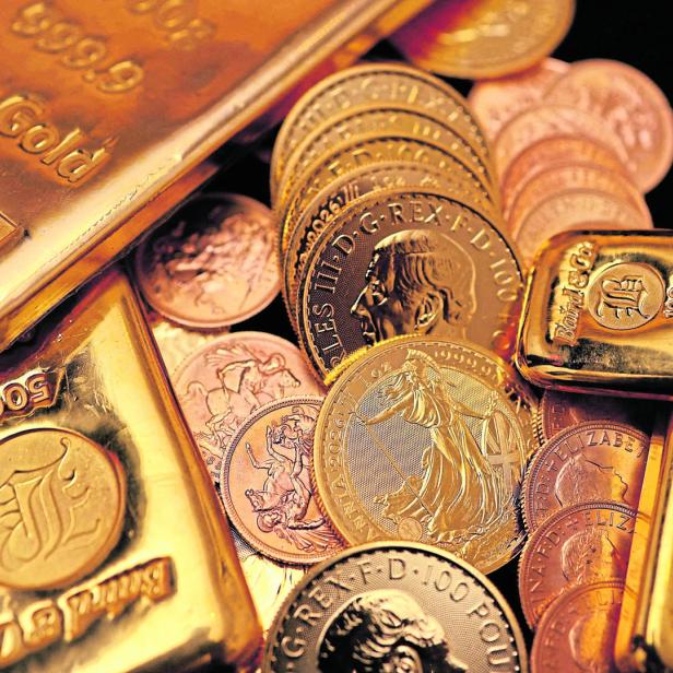FILE PHOTO: UK gold bars and coins are displayed in London