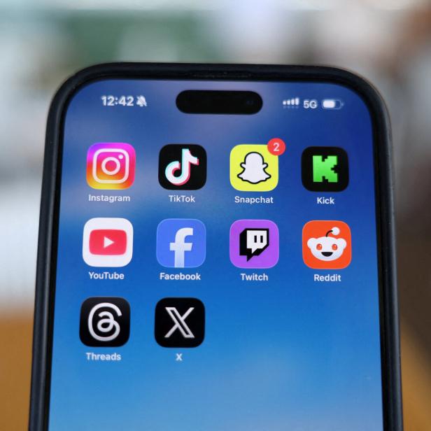 FILE PHOTO: Social media apps are displayed on a mobile phone