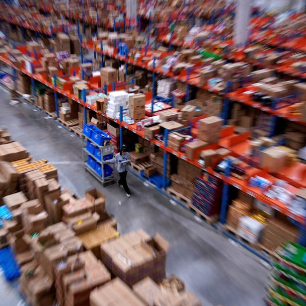 FILE PHOTO: Employee works at Cainiao, Alibaba's logistics unit in Wuxi