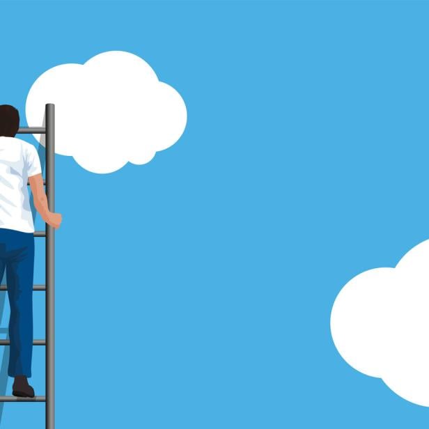 A man transforms a concrete wall into a blue sky, a symbol of hope.