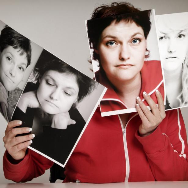 Concept of woman holding pictures of multiple personalities