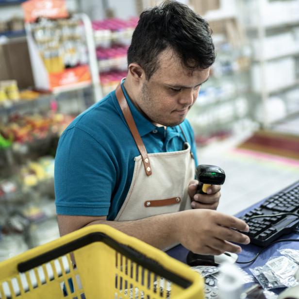 Special needs cashier working in a store