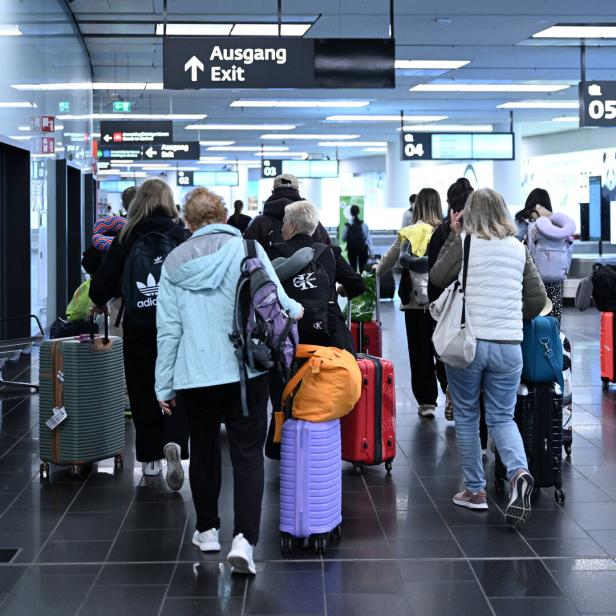 Passengers evacuated from the Middle East arrive at Vienna airport