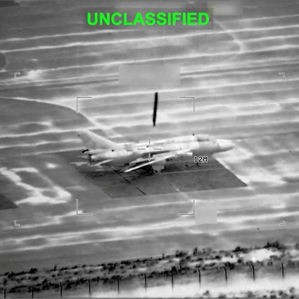 FILE PHOTO: A projectile falls on an aircraft at an unknown location in the still image obtained from a video released by U.S. Central Command (CENTCOM)