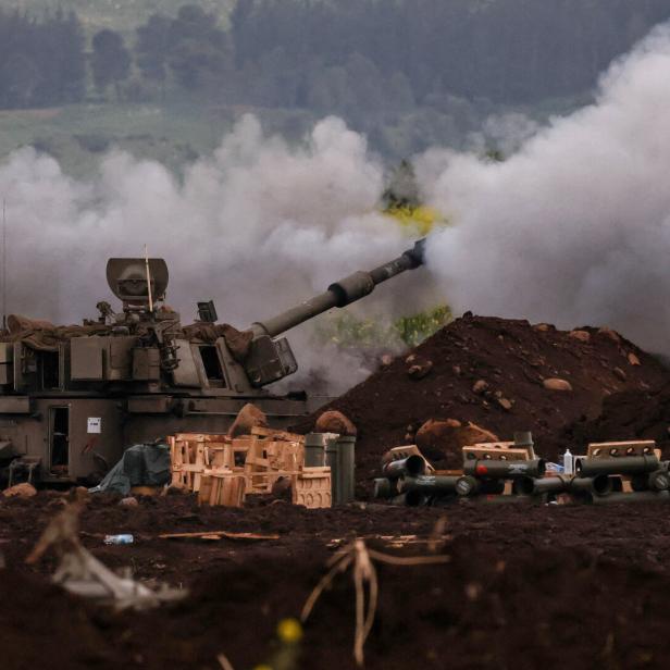 An Israeli artillery unit fires, on the Israeli side of the Israel-Lebanon border