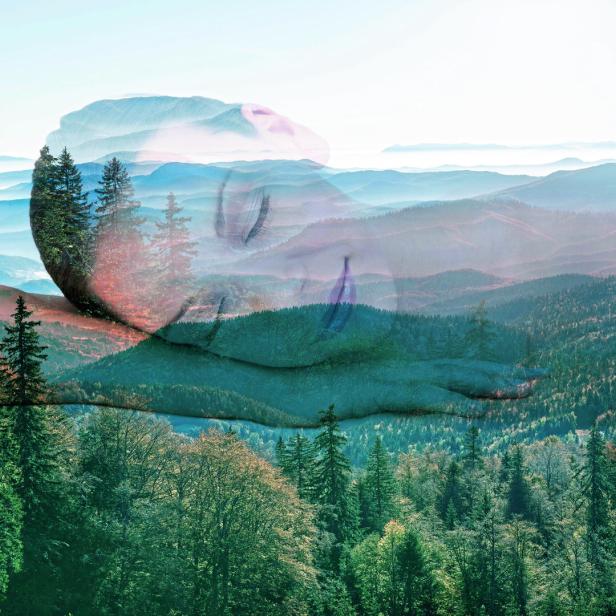 Double exposure of woman portrait and landscape