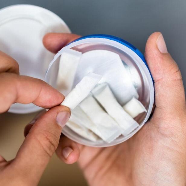 Woman Chewing Wet Moist Nicotine Product