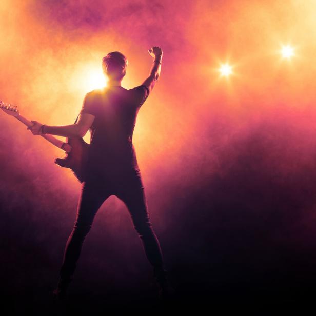 Guitarist playing a guitar on stage