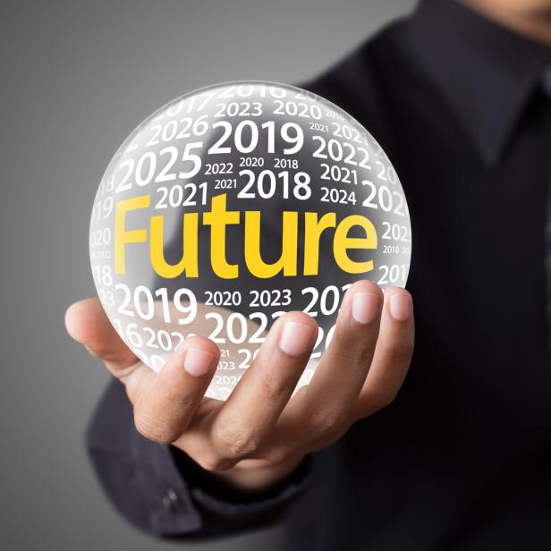 Businessman holding a glass ball