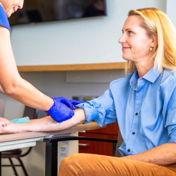 Blond Woman Phlebotomy Blood Draw in Hospital