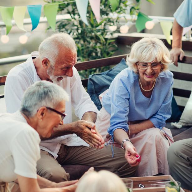 Senior Friends Playing Backgammon