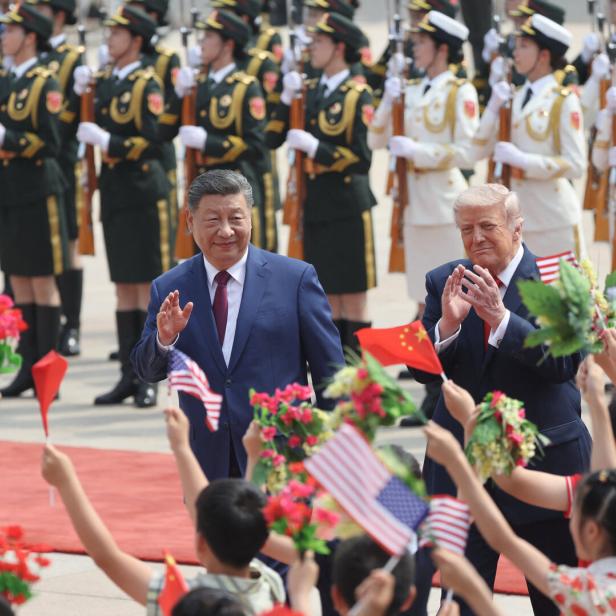 Chinese President Xi Jinping and U.S. President Donald Trump attend a welcome ceremony at the Great Hall of the People, in Beijing