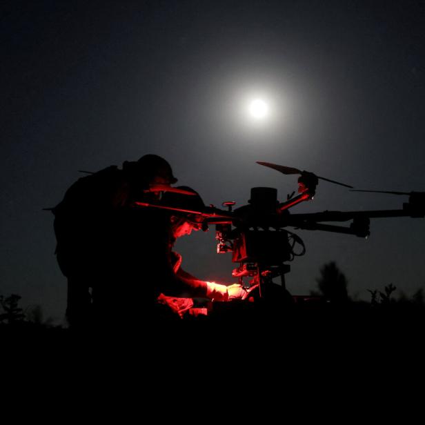 FILE PHOTO: Ukrainian servicemen prepare a heavy combat drone before flying it over positions of Russian troops near the frontline town of Chasiv Yar